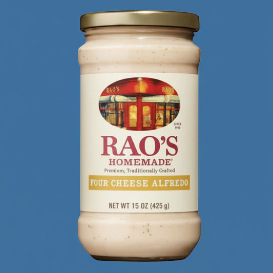 Pops Trading Company Rao's Homemade Four Cheese Alfredo Sauce in a 15 oz glass jar with a gold lid. Creamy sauce with visible specks.